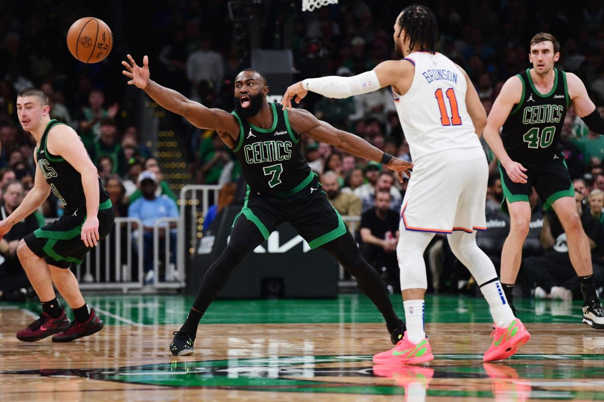 May 14, 2025; Boston, Massachusetts, USA; New York Knicks guard Jalen Brunson (11) passes the ball past Boston Celtics guard Jaylen Brown (7) in the second half during game five of the second round for the 2025 NBA Playoffs at TD Garden. Mandatory Credit: Bob DeChiara-Imagn Images